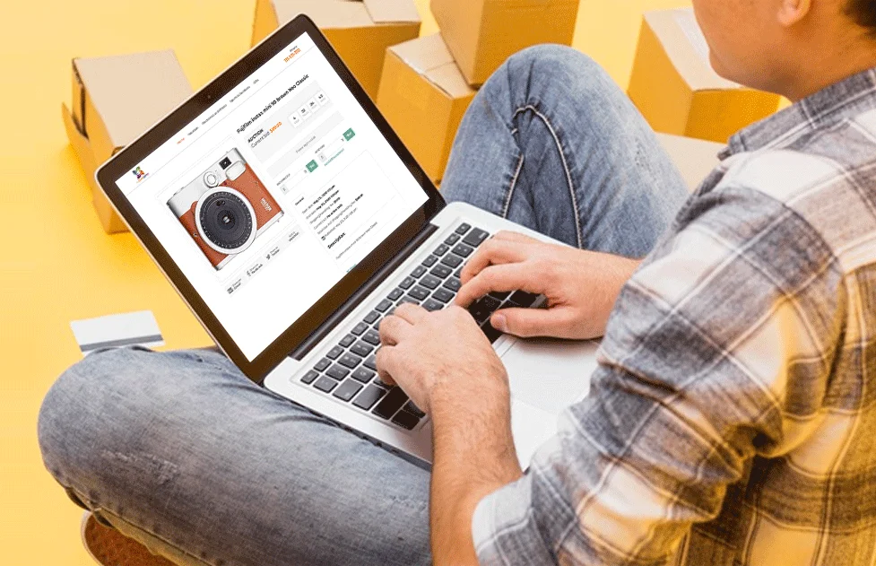 Example of an auction website shown on different devices